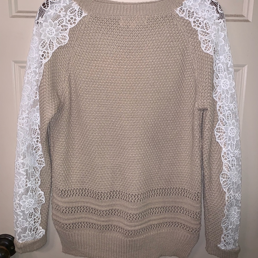Cute tan sweater.